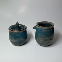 Handmade carved ceramic cream and sugar set