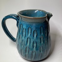 Handmade blue ceramic pitcher