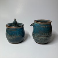 Handmade carved ceramic cream and sugar set