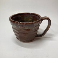 Handmade carved burgundy brown ceramic mug