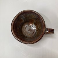 Handmade carved burgundy brown ceramic mug