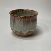 Handmade light blue handleless ceramic mug
