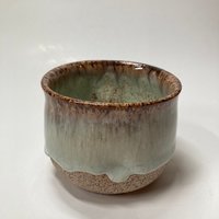 Handmade light blue handleless ceramic mug