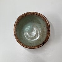 Handmade light blue handleless ceramic mug