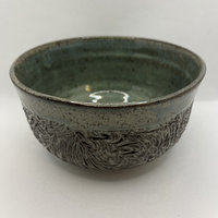 Handmade carved green ceramic bowl