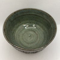 Handmade carved green ceramic bowl