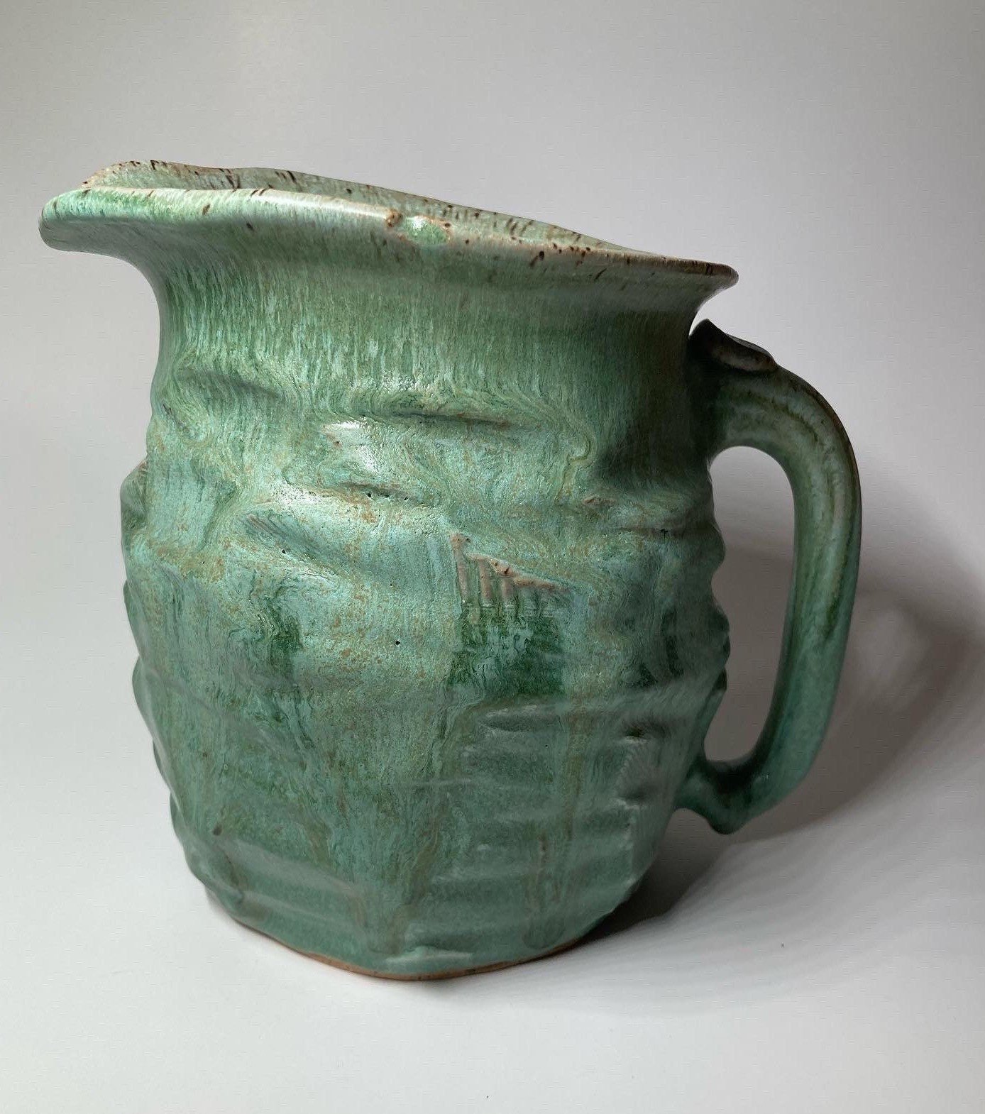 Chunky green ceramic pitcher