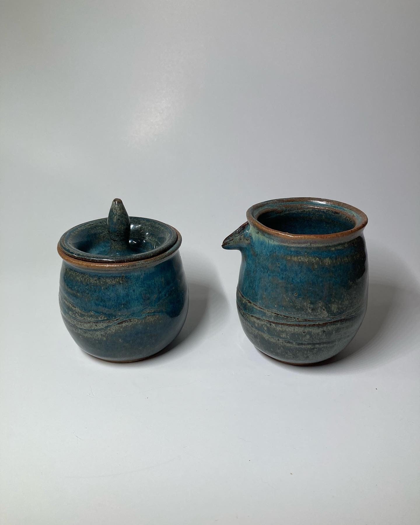 Handmade carved ceramic cream and sugar set