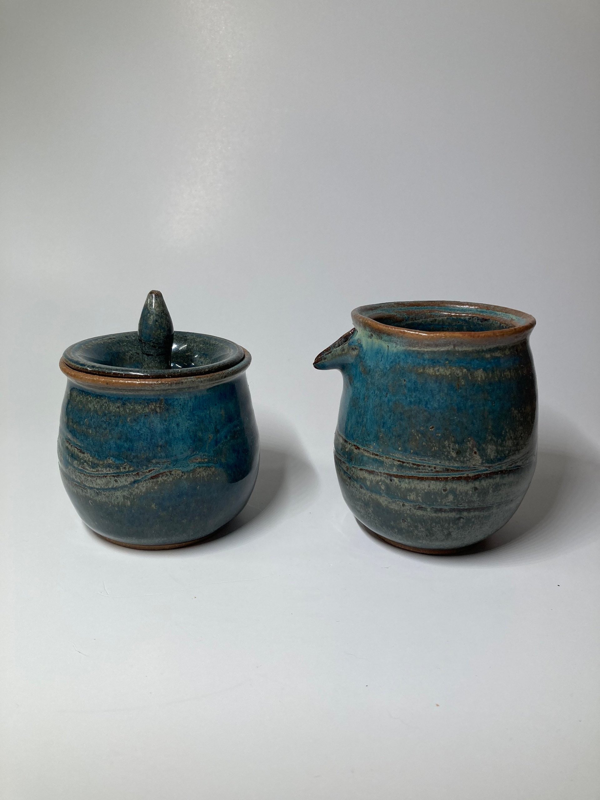 Handmade carved ceramic cream and sugar set