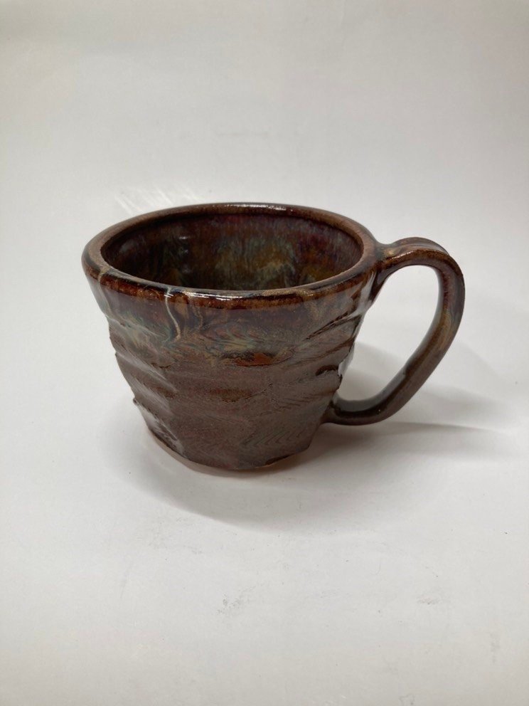 Handmade carved burgundy brown ceramic mug