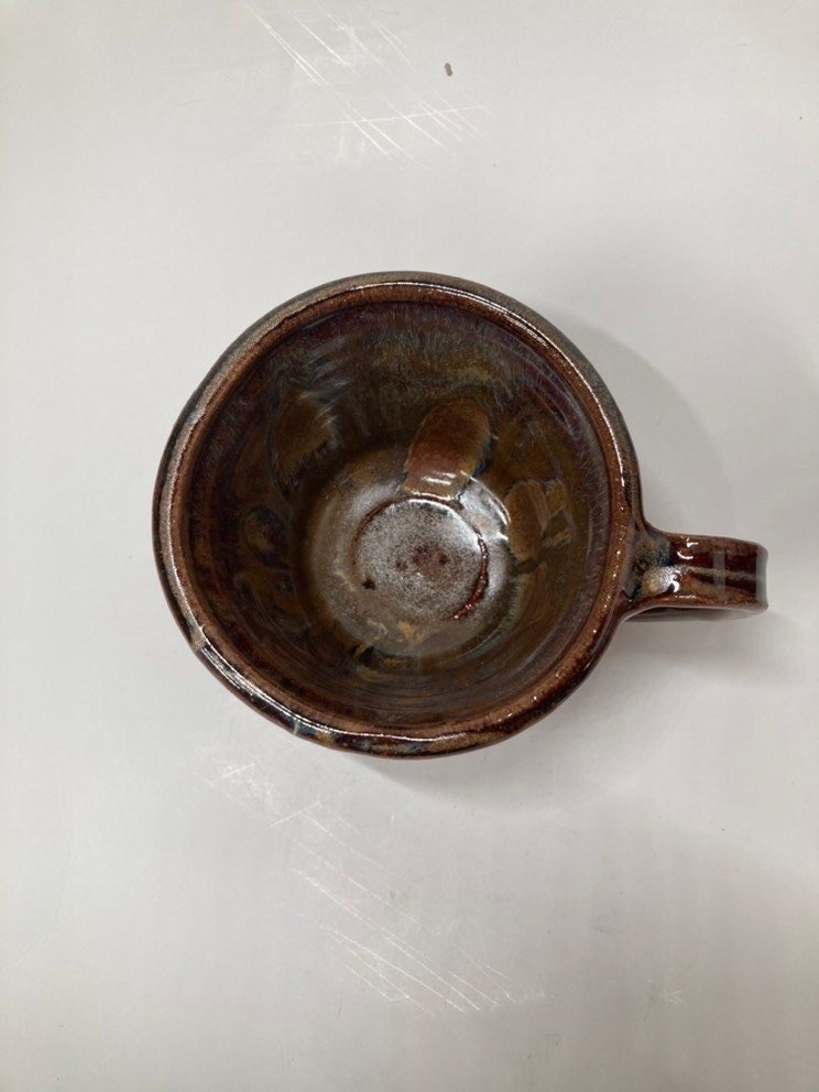 Handmade carved burgundy brown ceramic mug