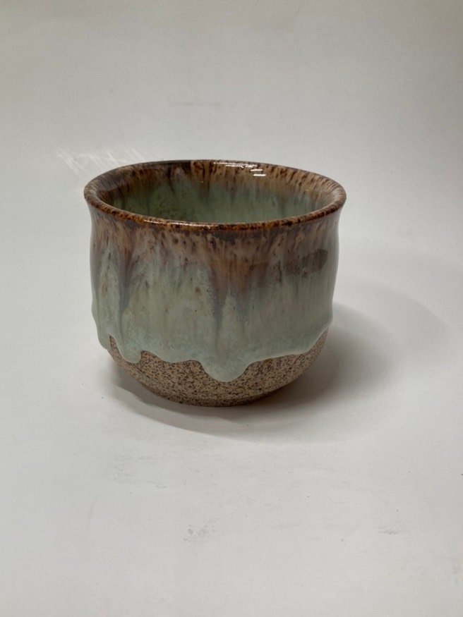 Handmade light blue handleless ceramic mug
