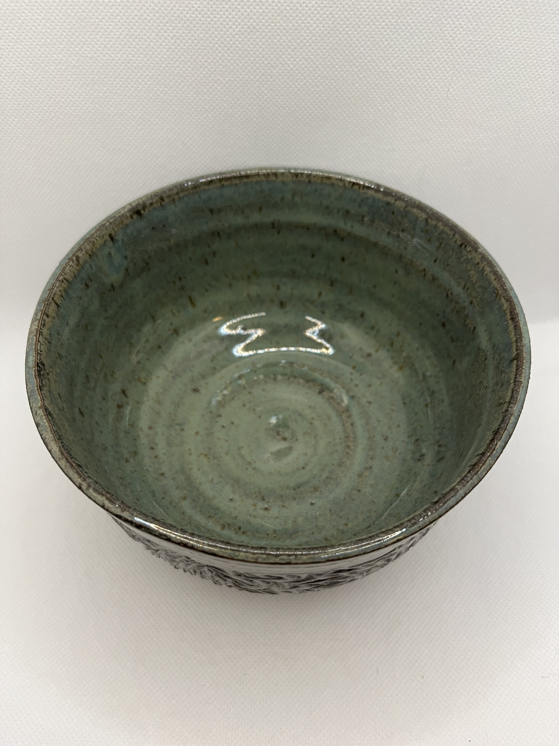 Handmade carved green ceramic bowl