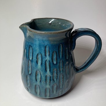 Handmade blue ceramic pitcher