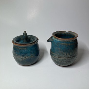 Handmade carved ceramic cream and sugar set