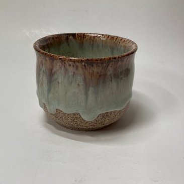 Handmade light blue handleless ceramic mug