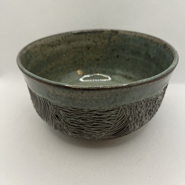 Handmade carved green ceramic bowl