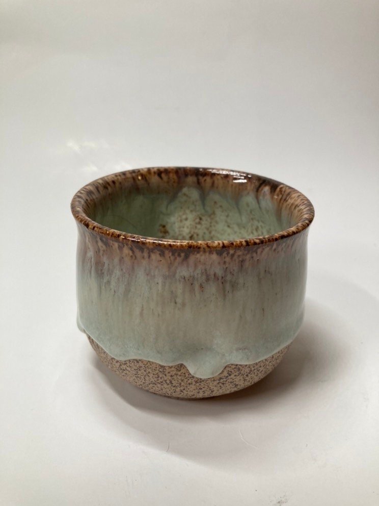 Handmade light blue handleless ceramic mug