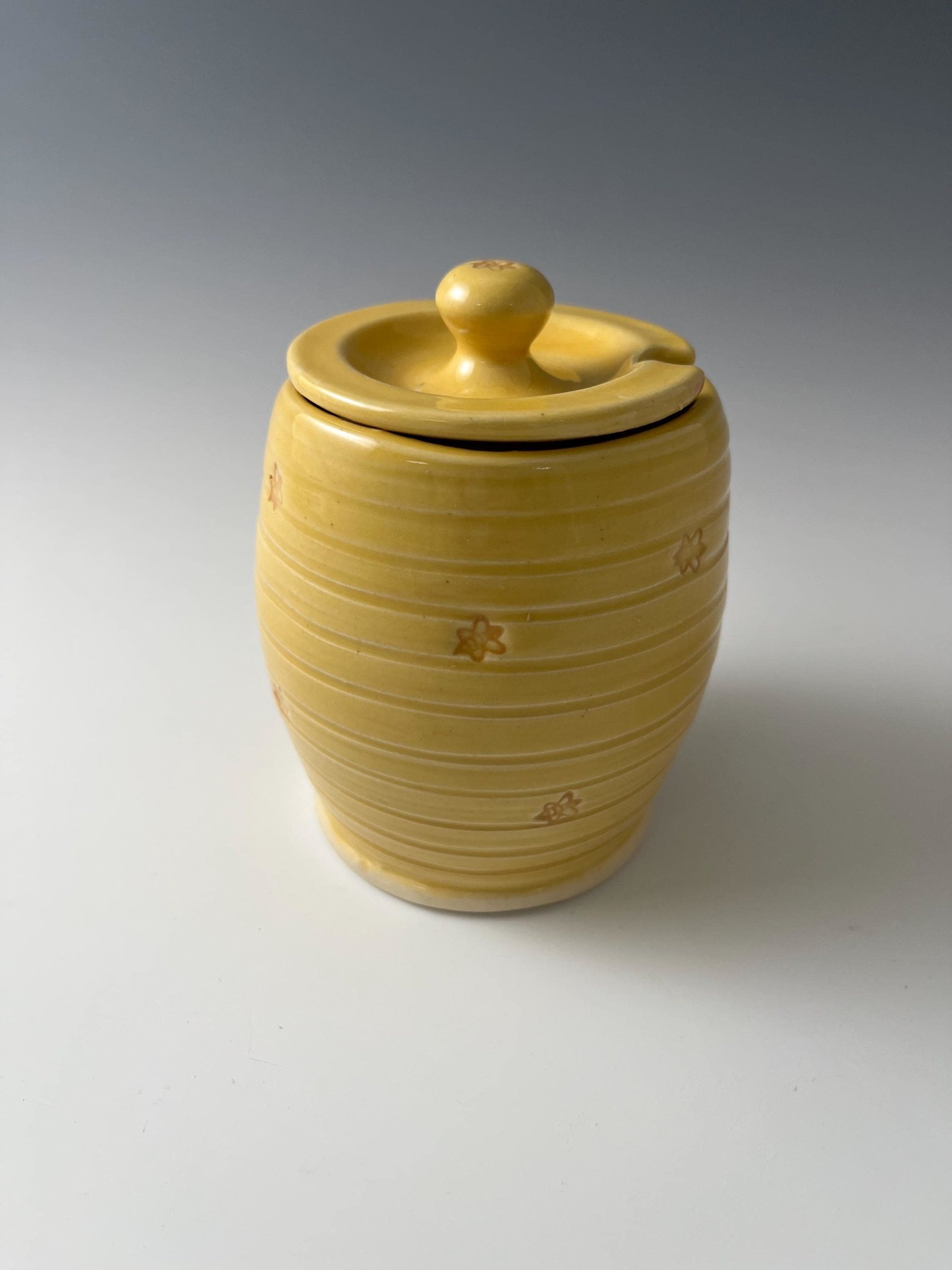 Handmade Ceramic Honey Jar - vibrant yellow with a bee design