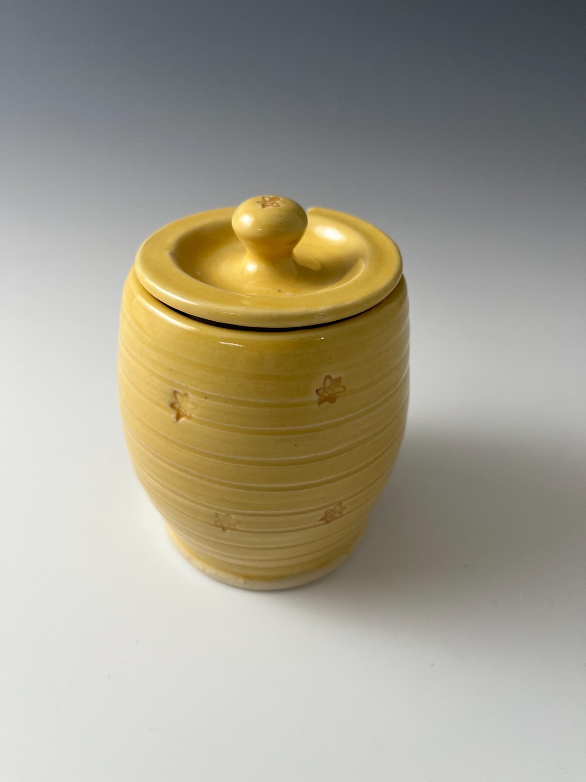 Handmade Ceramic Honey Jar - vibrant yellow with a bee design